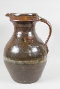 A drip glazed studio pottery ewer, with impressed makers mark to body, 13" high
