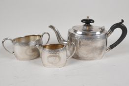 A C19th silver plated three piece Batchelor tea service of classical design, the teapot with