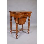 A C19th inlaid walnut work box, with fold out top inset with baize, frieze drawers and pull out