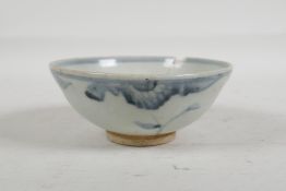 A Chinese Ming style blue and white porcelain rice bowl with floral decoration, 5" diameter
