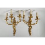 A pair of Rococo style ormolu three branch wall sconces, 18"