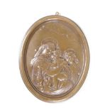 An embossed oval bronze plaque, depicting 'The Madonna, Jesus and St John, 5" x 6"