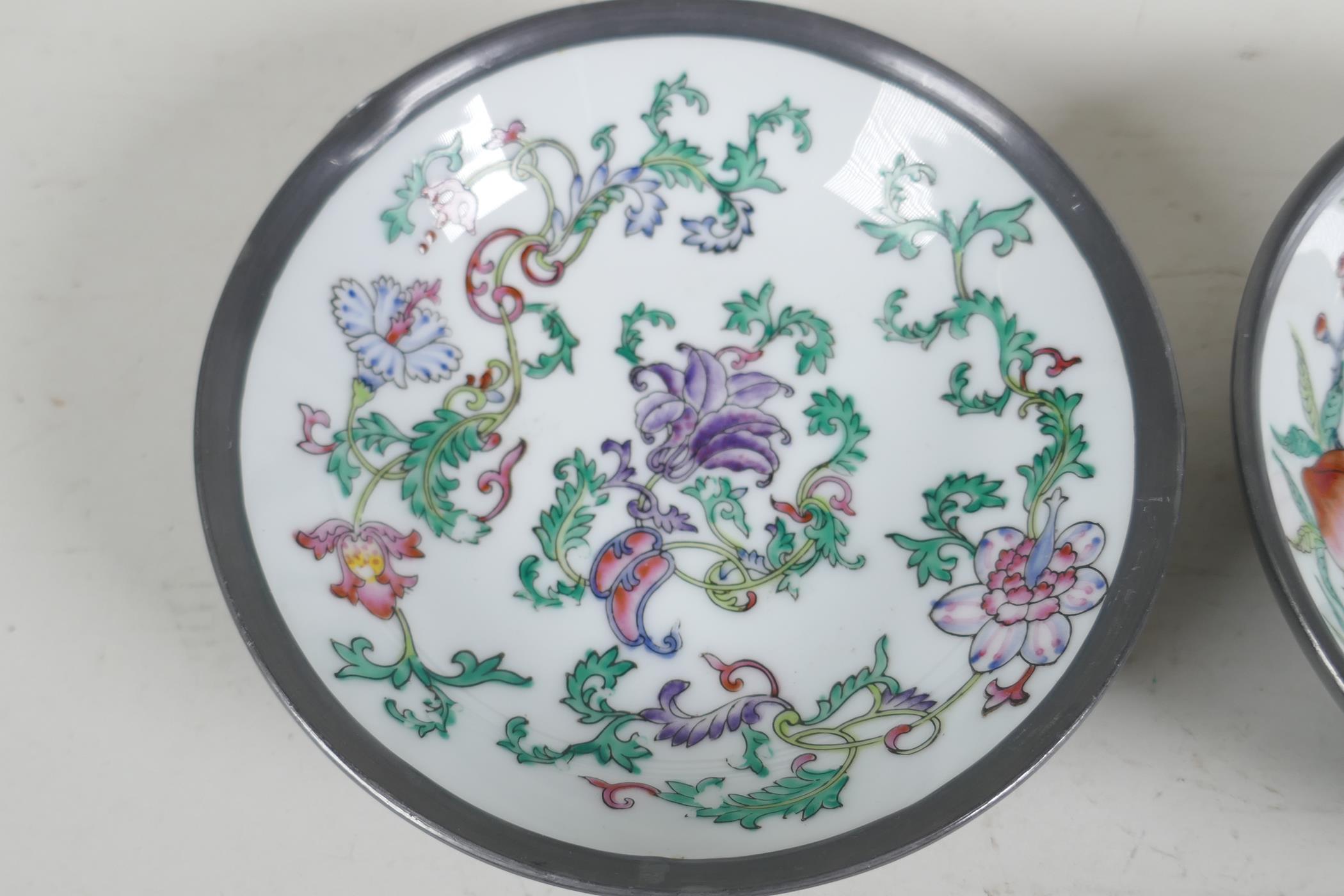 A pair of Chinese porcelain bowls painted with fruit flowers and bats, encassed in pewter frames. 6" - Image 2 of 4