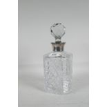 A cut glass decanter with silver mount, 10" high