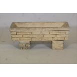 A reconstituted stone planter moulded as Cotswold stone, 30" x 10"