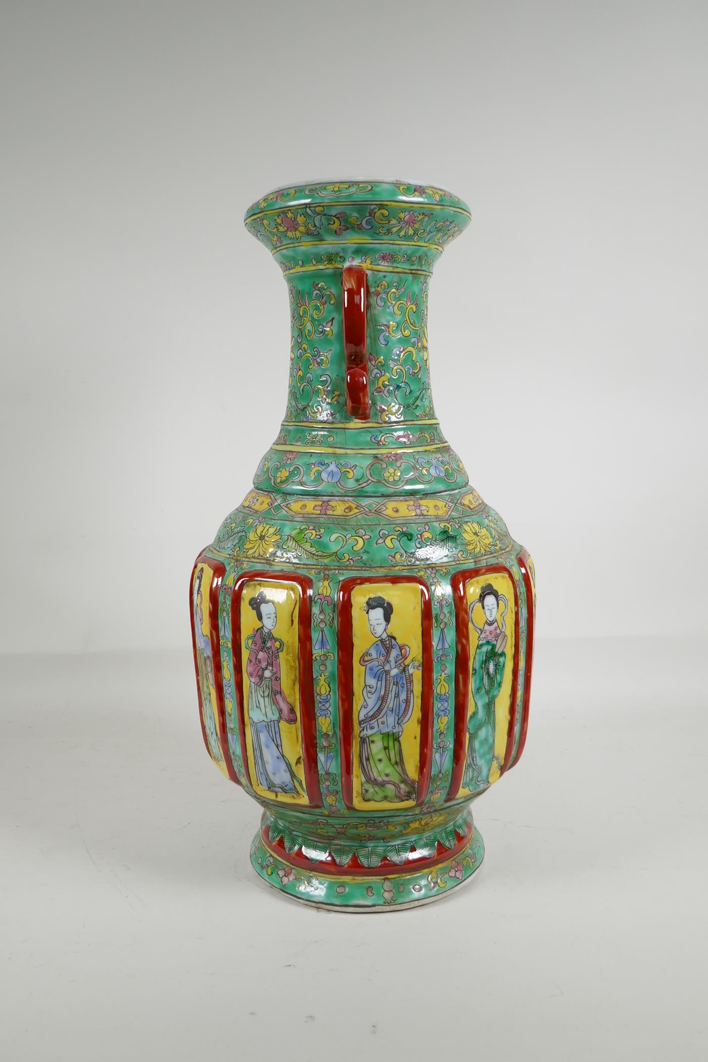 A Chinese polychrome porcelain two handled vase with raised decorative enamelled panels, depicting - Image 4 of 5