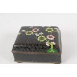 An Oriental cloisonne trinket box, decorated with prunus blossoms on a black ground. 3½" x 3" x 2"