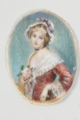 An early C19th miniature of a young girl, 1½" long, unframed