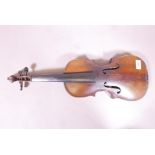 An antique violin, the one piece back with grain painted decoration, 23" long