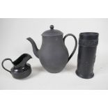 A Wedgwood black basalt coffee pot with unglazed exterior, 8" high, with a black basalt pill vase,
