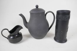 A Wedgwood black basalt coffee pot with unglazed exterior, 8" high, with a black basalt pill vase,