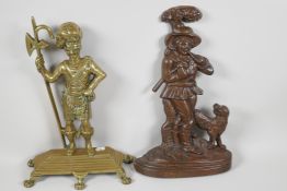 A cast brass door stop in the form of a Scots Guard, 14" high, together with a coppered doorstop