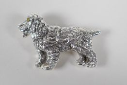 A sterling silver brooch in the form of a Spaniel, 2" long