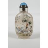 A Chinese reverse decorated glass snuff bottle, decorated with a musician & student in a