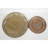 A Persian brass tray with figural decoration of musicians and their audience, and a smaller