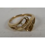 A 9ct gold dress ring, stones missing, 2.6g