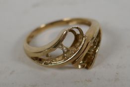 A 9ct gold dress ring, stones missing, 2.6g