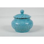 A Chinese turquoise glazed porcelain jar & cover, with raised stylised dragon decoration,