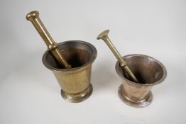 An antique brass mortar and pestle, 6" high, and another similar