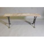 A plank top bench on wrought iron end supports, stamped Wake & Dean, London, 50" x 12" x 19"