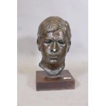 Painted plaster head study of a young man, on a wood base, 15" high