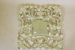 A Florentine style silver composition wall mirror, 31" x 31"