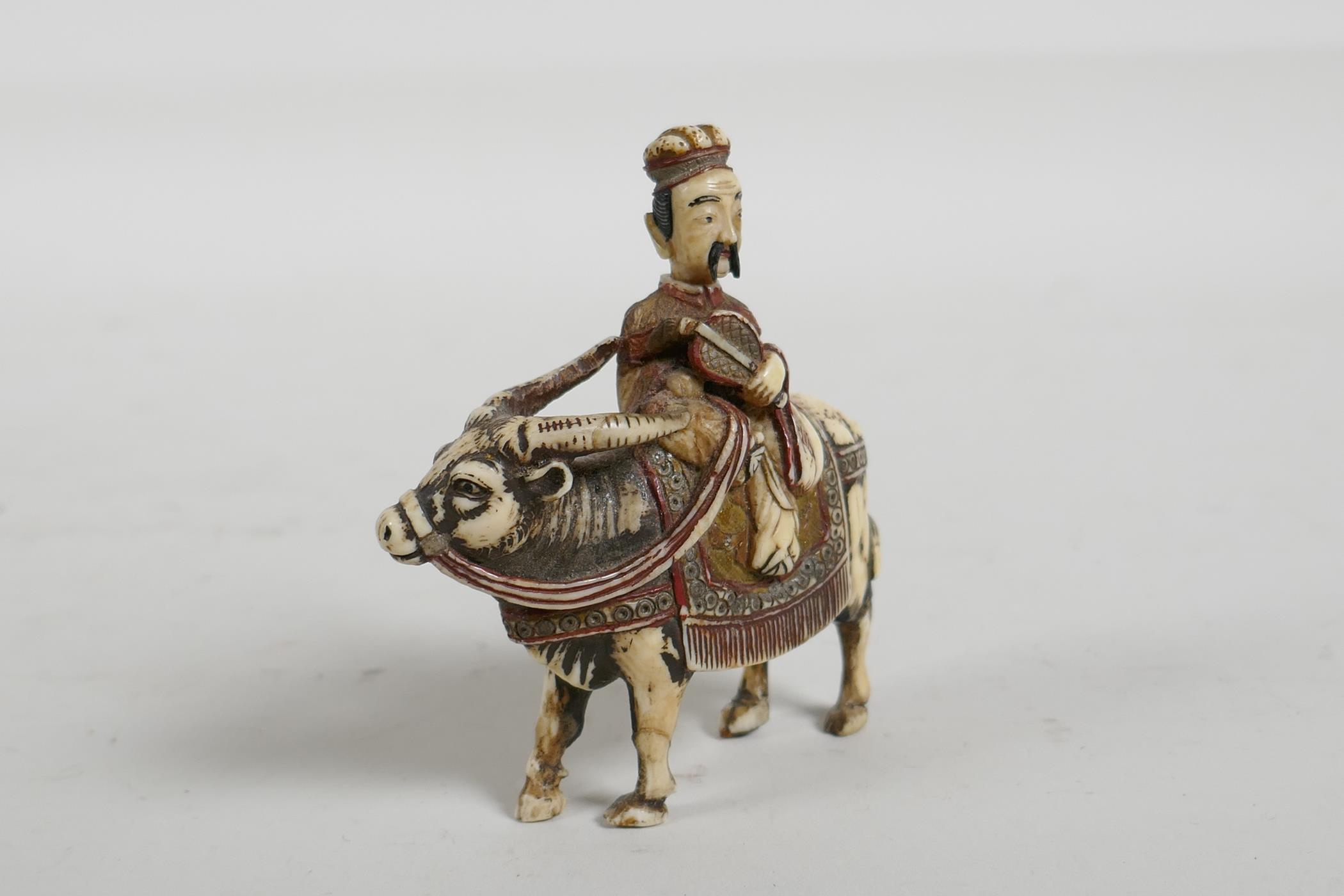 A C19th carved and stained bone snuff bottle in the form of a Chinese man riding a yak, 3" high - Image 3 of 5