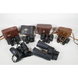 Six pairs of various binoculars, including a Maginon 10-30x60, Bushnell 8x42 WA, Noctovist MK11