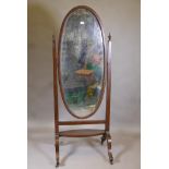 A Victorian mahogany cheval mirror with original bevelled glass, raised on cabriole supports with