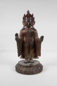 A Sino-Tibetan bronze Buddha on a lotus plinth, with remnants of gilt & lacquer patina