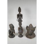 Three African Yoruba tribe wood carvings of a kneeling female figure, a figural totem/staff and head