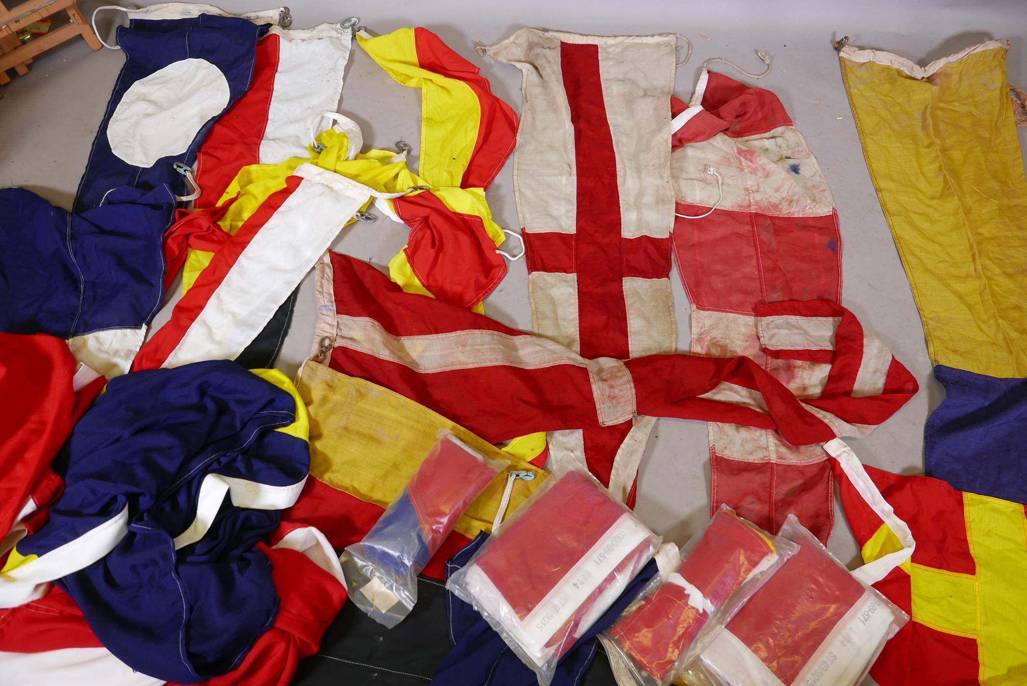 Twenty four Royal Navy Ship's signal flags and pennants, and National flags of Bolivia, Cuba,