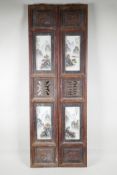 A pair of Chinese polychrome porcelain and hardwood panels, each with two porcelain plaques,