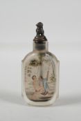 A Chinese reverse decorated glass snuff bottle with erotic decoration & character inscription verso,