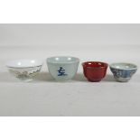 A Chinese flambe tea bowl, a Japanese blue and white porcelain tea bowl with character decoration, a