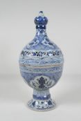 A Chinese blue & white porcelain incense burner & cover, decorated with lotus flowers & the eight