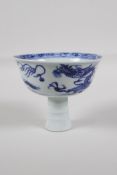 A Chinese blue & white porcelain stem cup, decorated with a dragon chasing the flaming pearl, 3½"