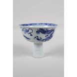 A Chinese blue & white porcelain stem cup, decorated with a dragon chasing the flaming pearl, 3½"