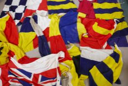 Seventeen Royal Navy Ship's signal flags, pennants and a white Ensign, flags mostly size 6, hand