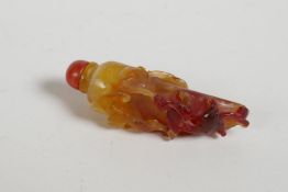 A Chinese agate snuff bottle in the form of a chilli with carved bat and kylin decoration, 3" high