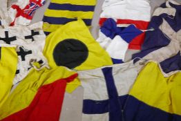 Twelve vintage Royal Navy ship's signal flags, hand stitched linen with bronze toggles, mostly