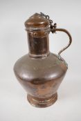 A large Eastern copper flagon and cover, 17" high