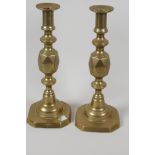 A pair of C19th brass "The Queen of Diamonds" pattern candlesticks, 11½" high