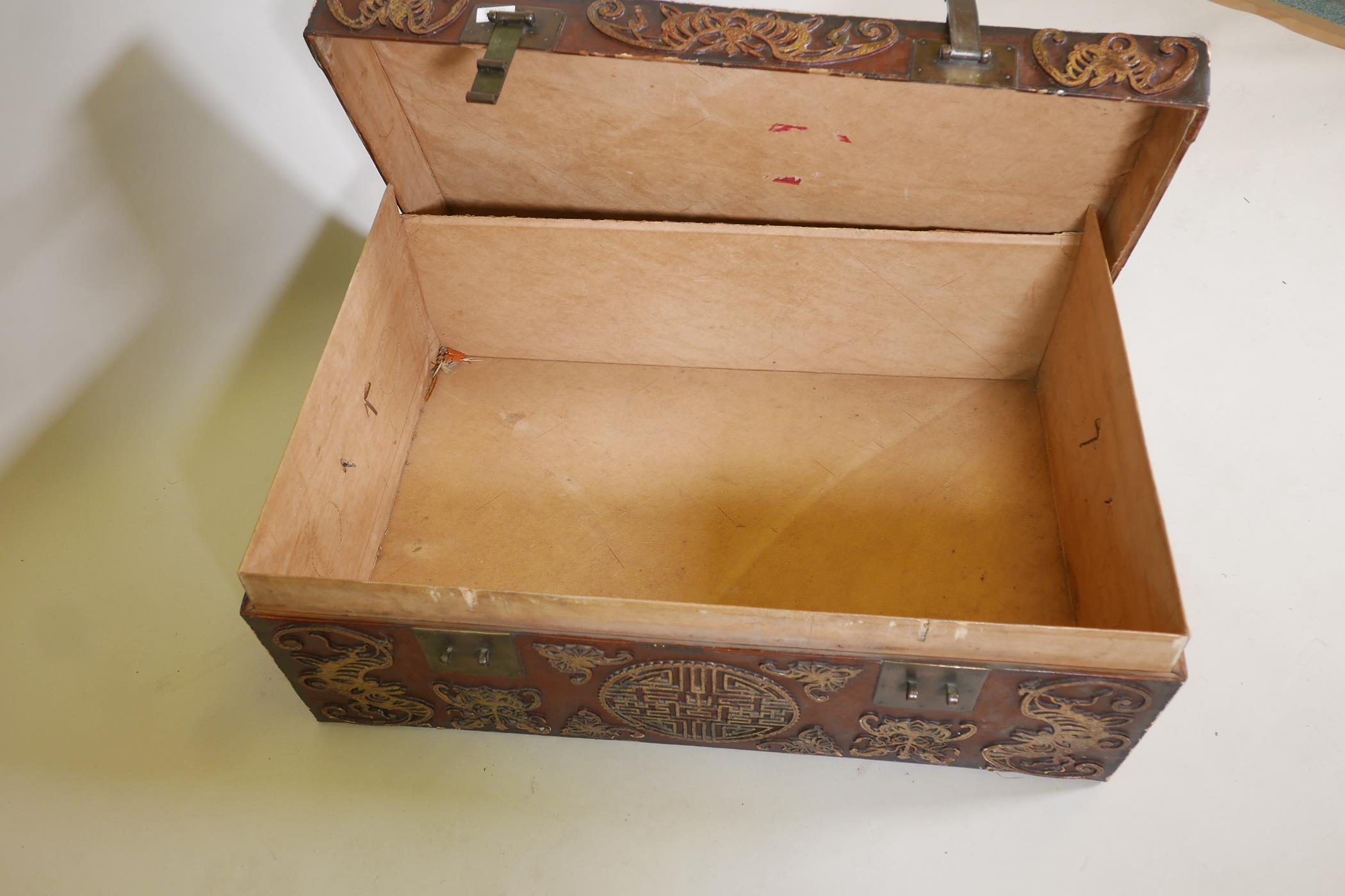 A chinoiserie lacquered pigskin trunk, with parcel gilt raised moulded decoration and brass - Image 5 of 5