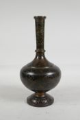 An Indo Persian bidriware vase with scrolling leaf decoration, 10" high