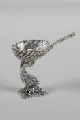 A miniature 925 silver salt & matching spoon, in the form of a dolphin holding a clam shell, 1½"