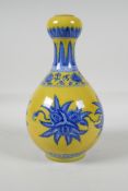 A yellow ground porcelain garlic head shaped vase, with blue & white floral decoration, Chinese, 6
