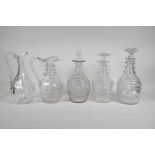 Three Georgian cut glass ring neck decanters, and two Georgian cut glass jugs, 1 A/F, largest 11"