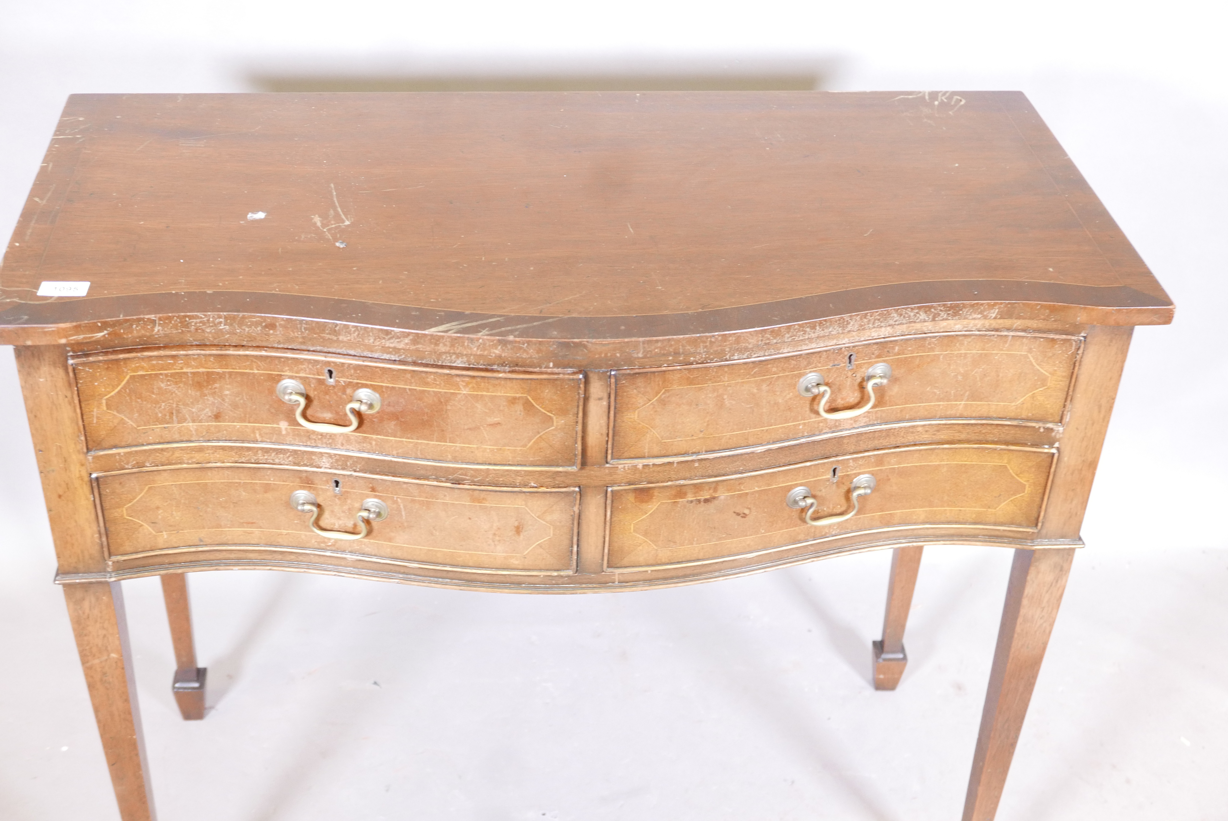 An inlaid mahogany serpentine front four drawer canteen, raised on tapering supports, with spade - Image 2 of 2