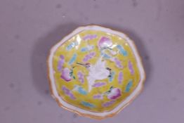 A Chinese Republic ceramic stem bowl with enamel decoration of lotus and birds on a yellow glazed